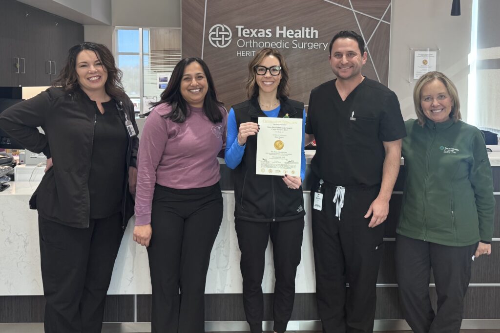 Briseno and his team at Texas Health Surgery Center holding an award